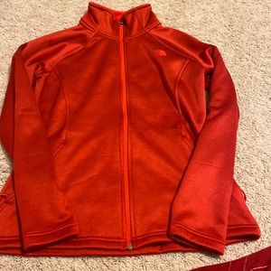 Red north face jacket